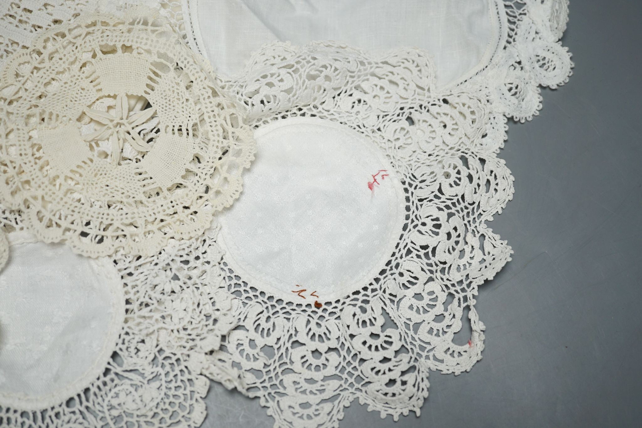 A quantity of mixed crochet, embroidered and cut work table linens.